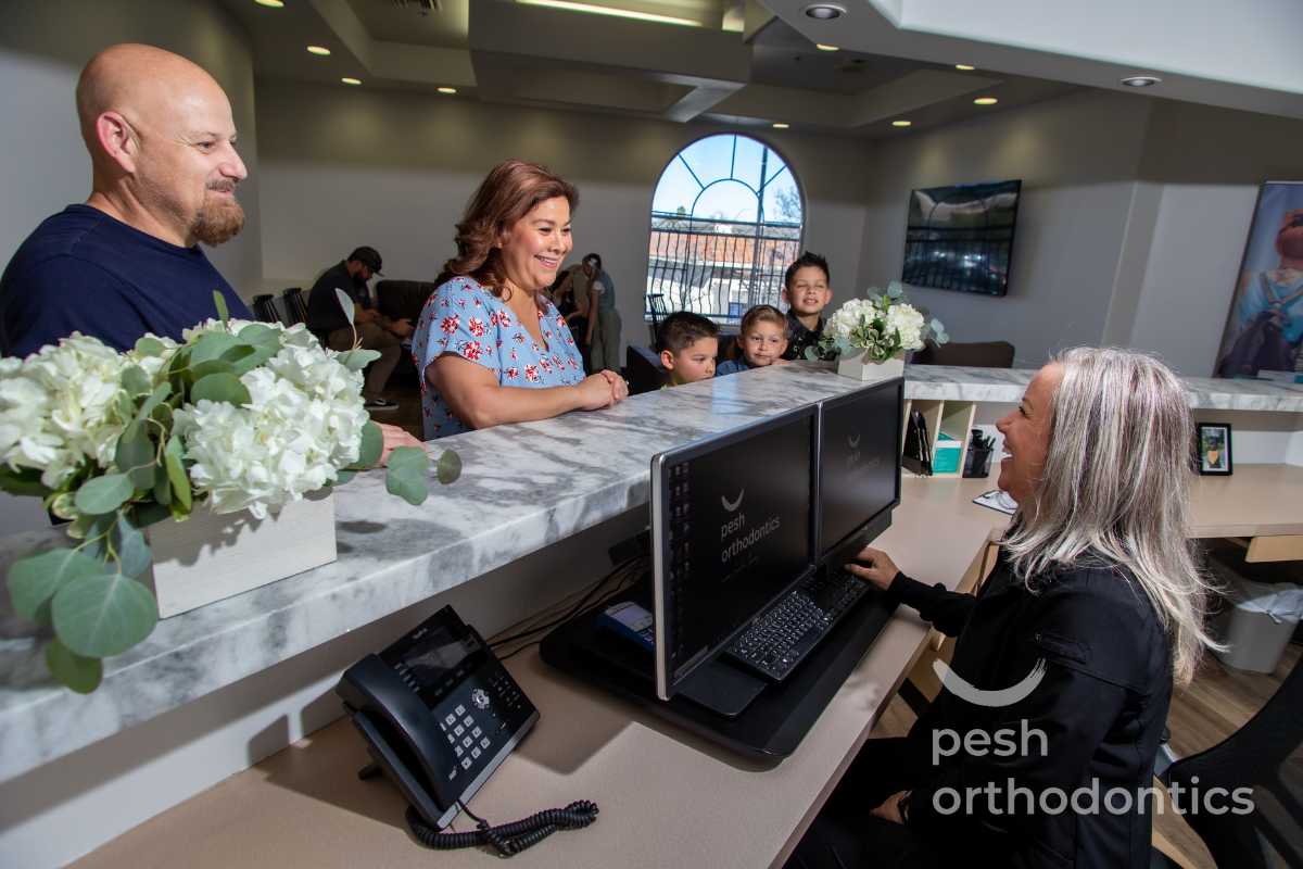Patient receiving orthodontic care at Pesh Orthodontics in Menifee, CA